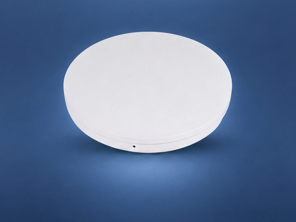 Araknis 830 Wi-Fi 7 indoor access point on the matching blue studio background