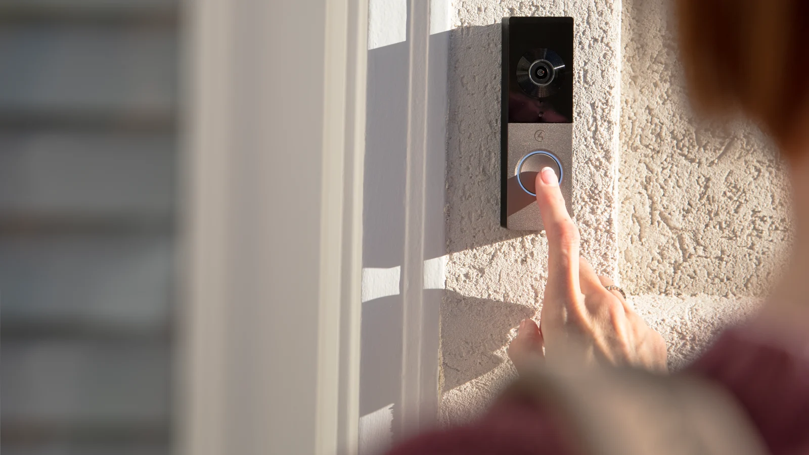 Visitor pressing a Control4 Chime video doorbell