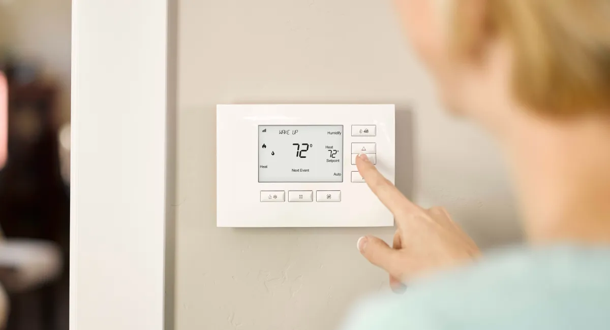 Control4 Wireless Thermostat by Aprilaire installed on a home wall