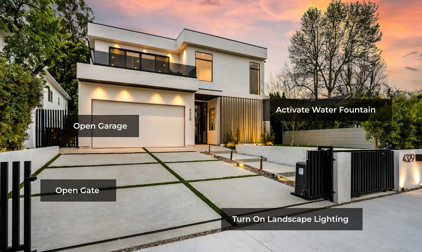 Modern home entrance with a driveway gate, garage door and coordinated Control4 arrival scene