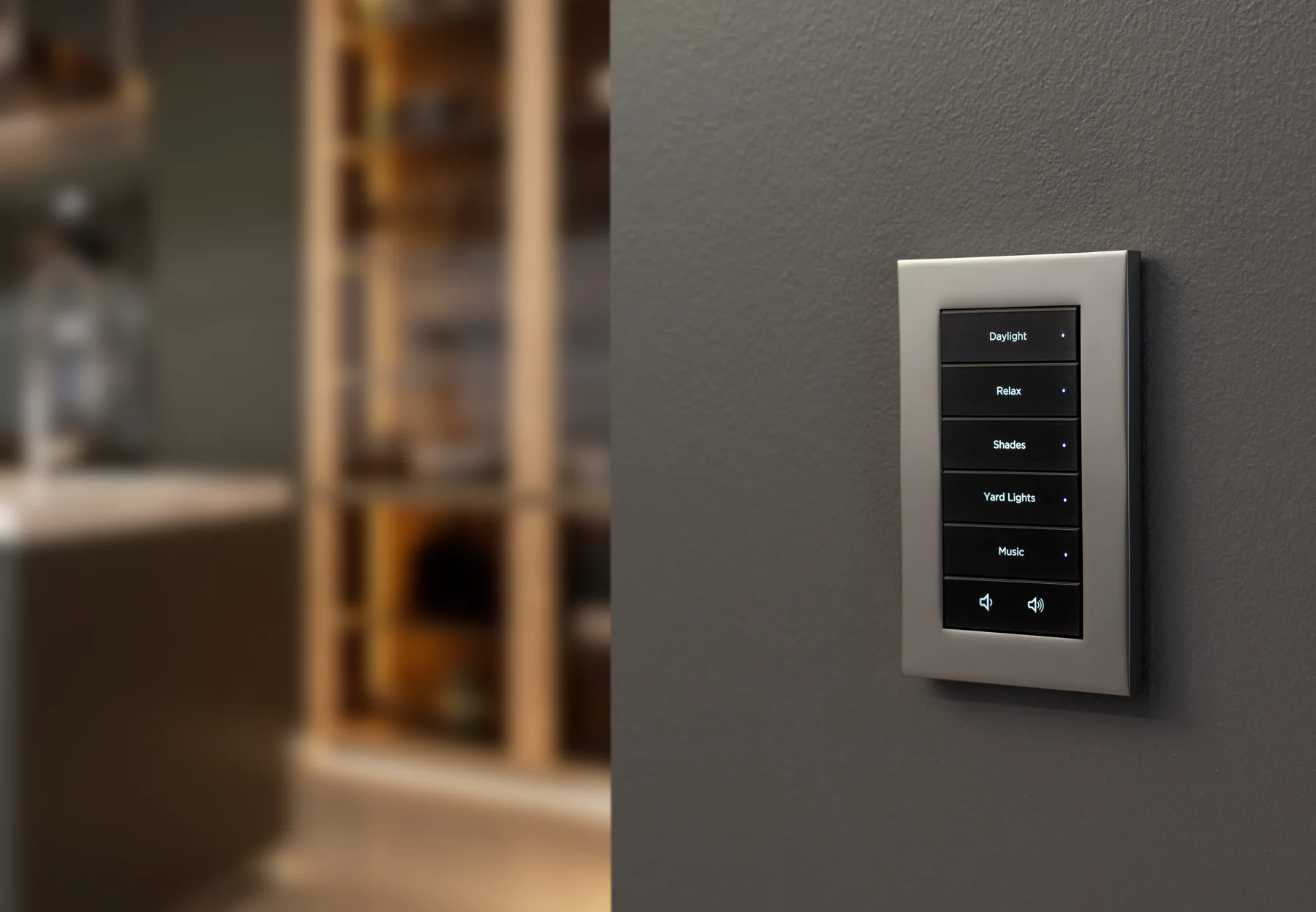 Lux by Control4 single-gang engraved keypad installed on a dark wall