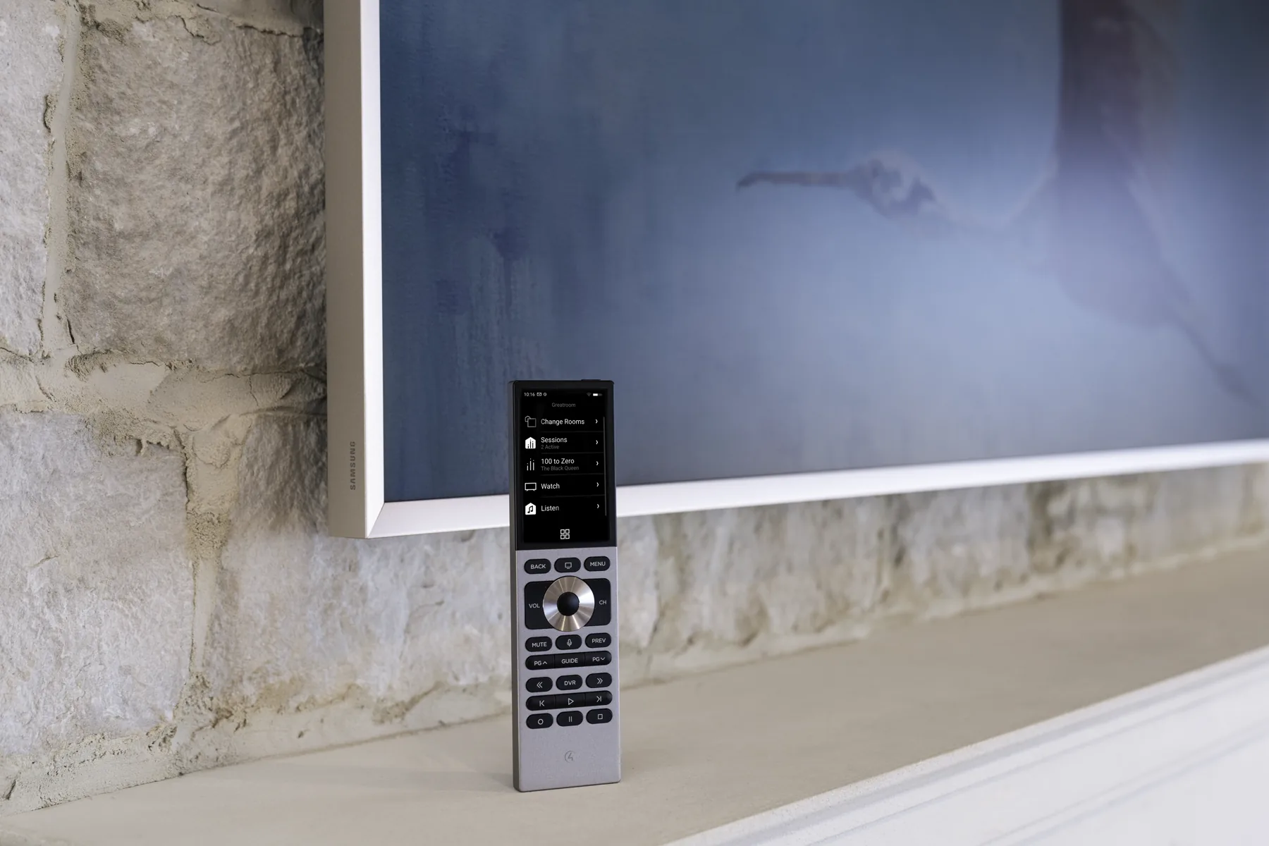 Silver Control4 Halo Touch remote shown in a finished living room