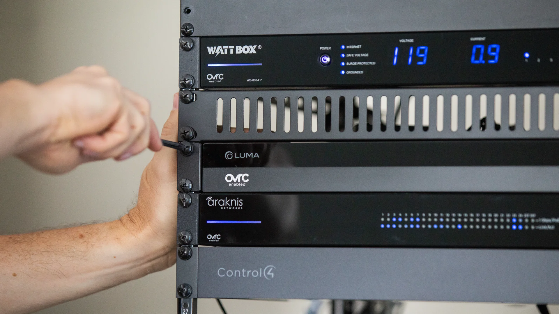 Luma network video recorder installed with WattBox, Araknis and Control4 equipment in an AV rack