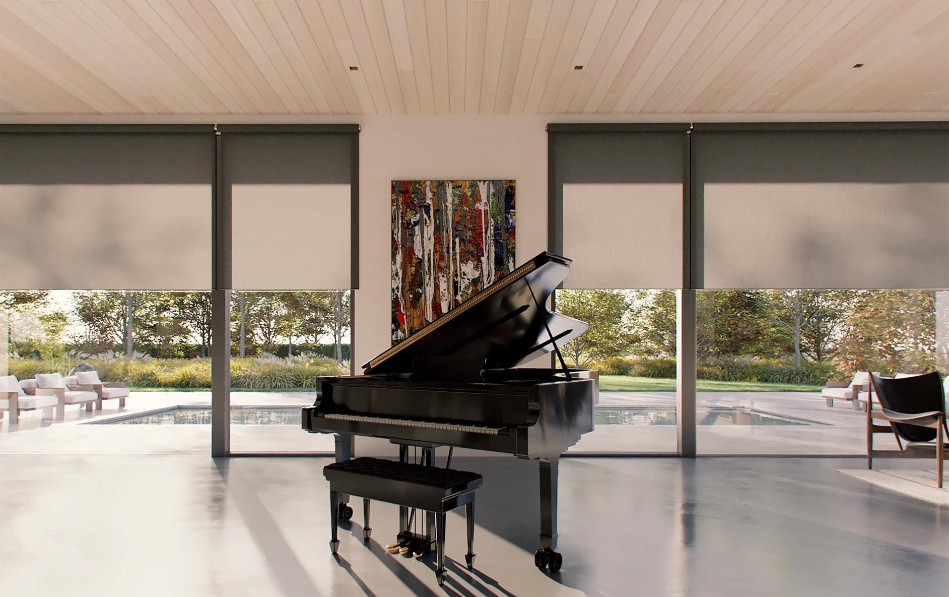Multiple motorized roller shades controlling daylight around a piano room
