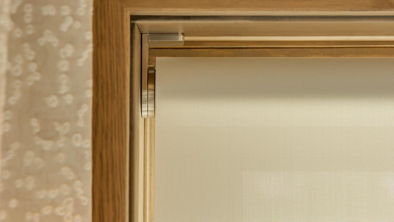 Close view of a wired Lutron Palladiom motorized roller shade bracket