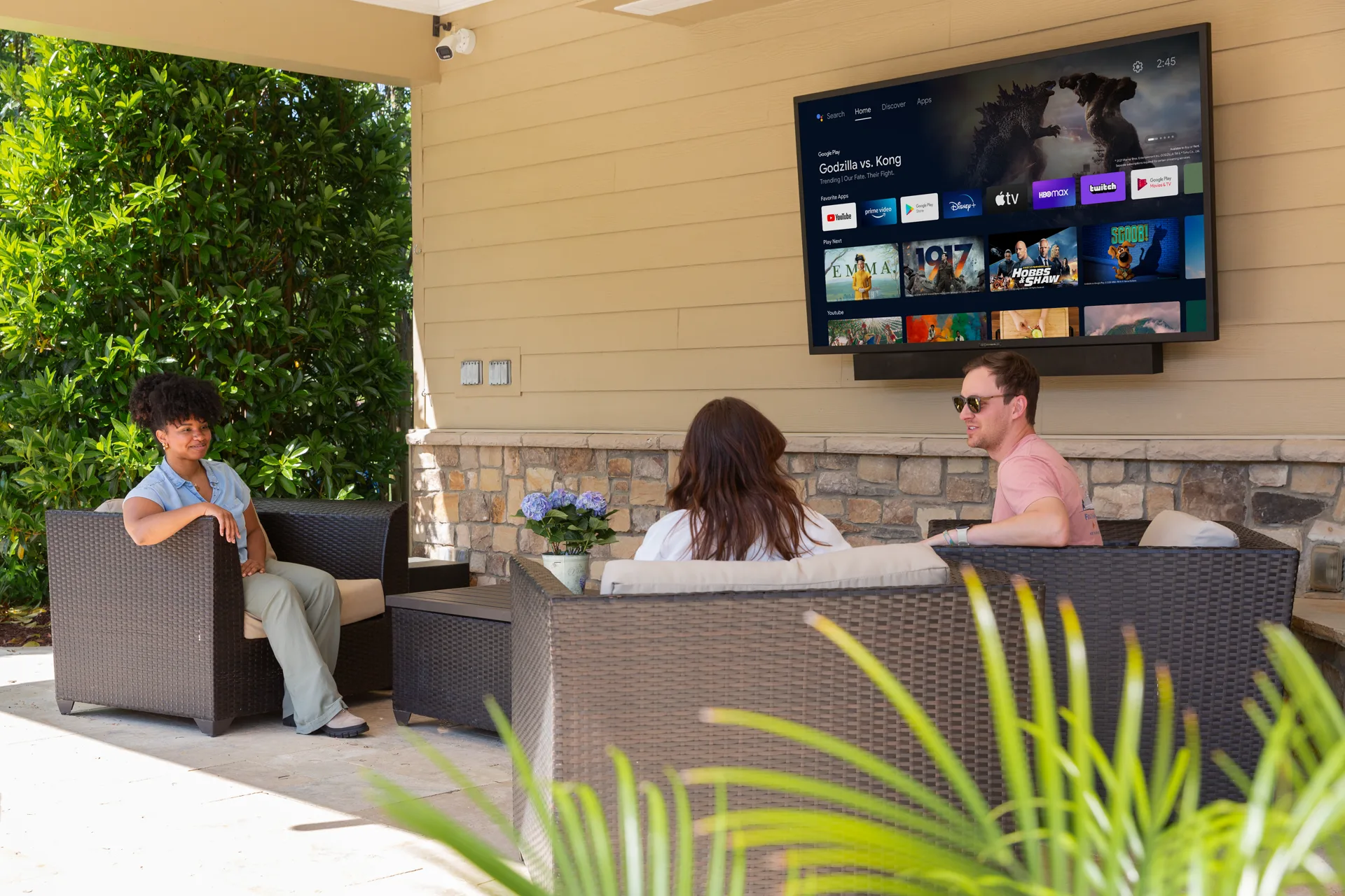 SunBrite outdoor television and soundbar in a covered patio seating area