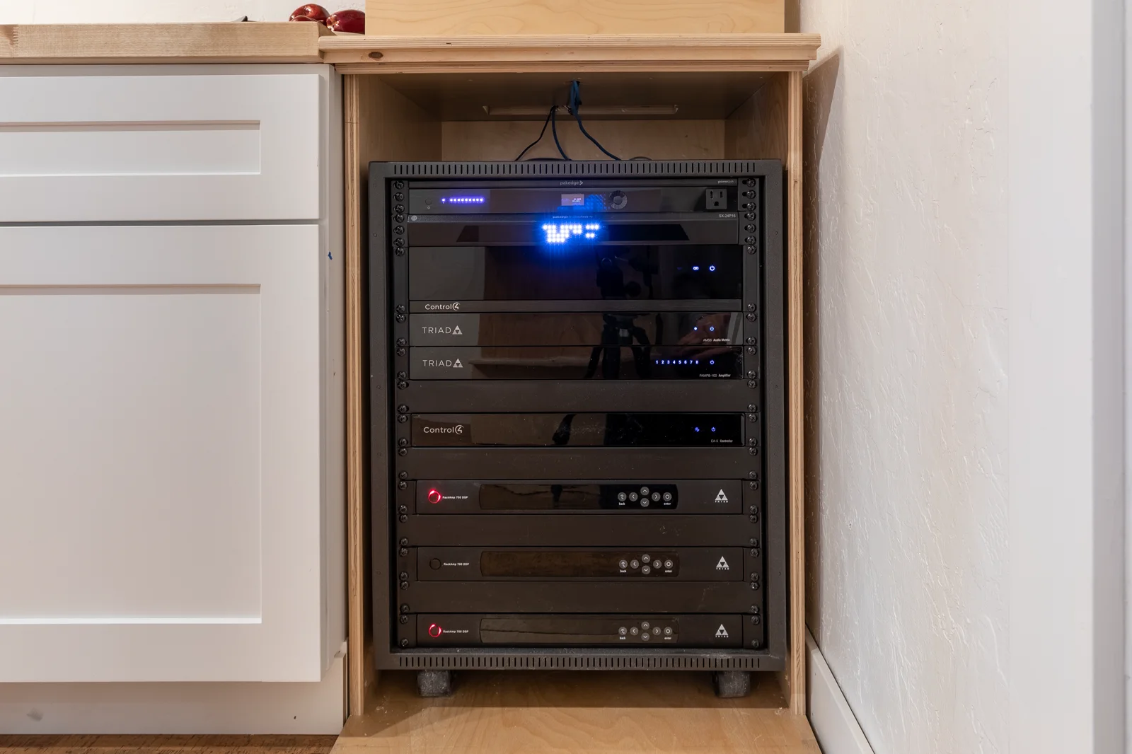 Installed Control4 and Triad whole-home audio equipment rack