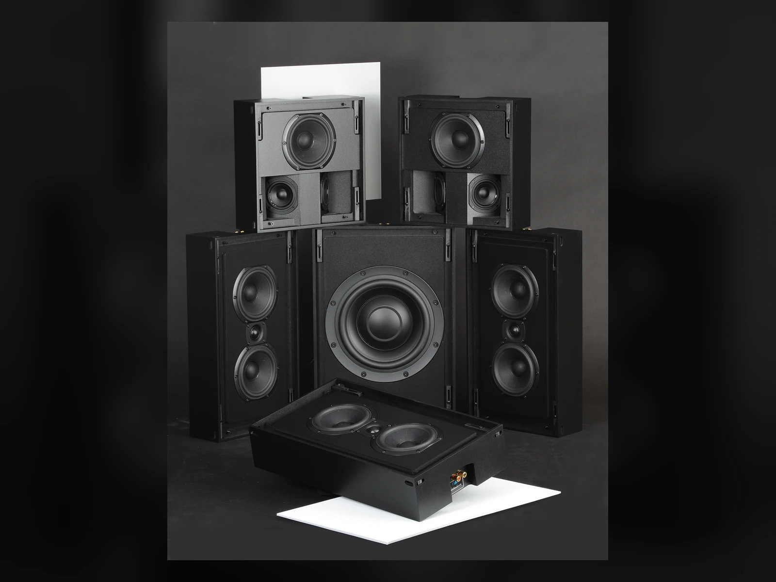 Triad Bronze speaker family on a dark blue studio background