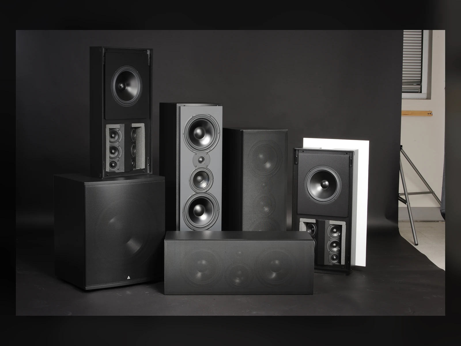 Triad Gold speaker family on a dark blue studio background