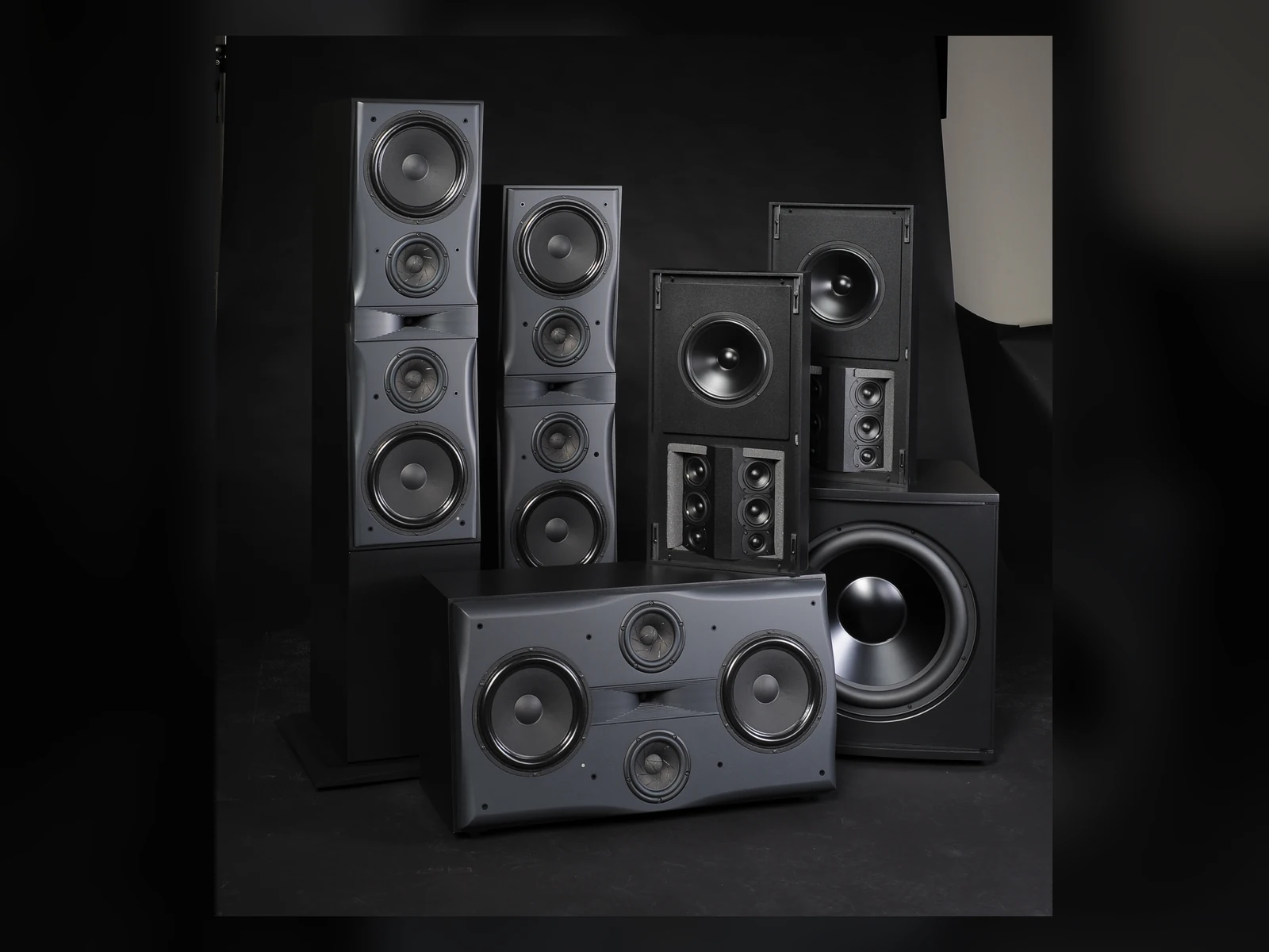 Triad Platinum speaker family on a dark blue studio background