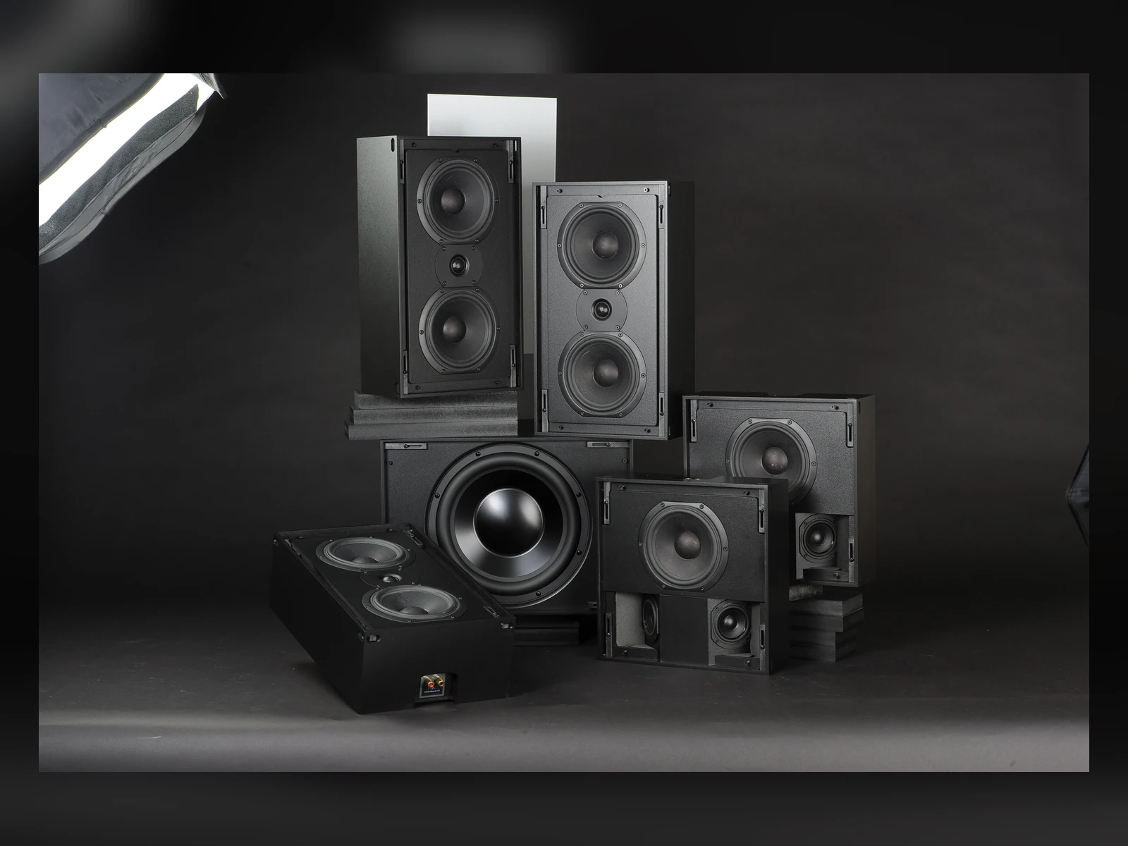 Triad Silver speaker family on a dark blue studio background