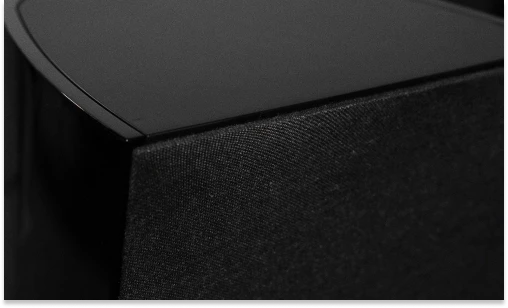 Close view of a Triad powered subwoofer cabinet and magnetic grille finish