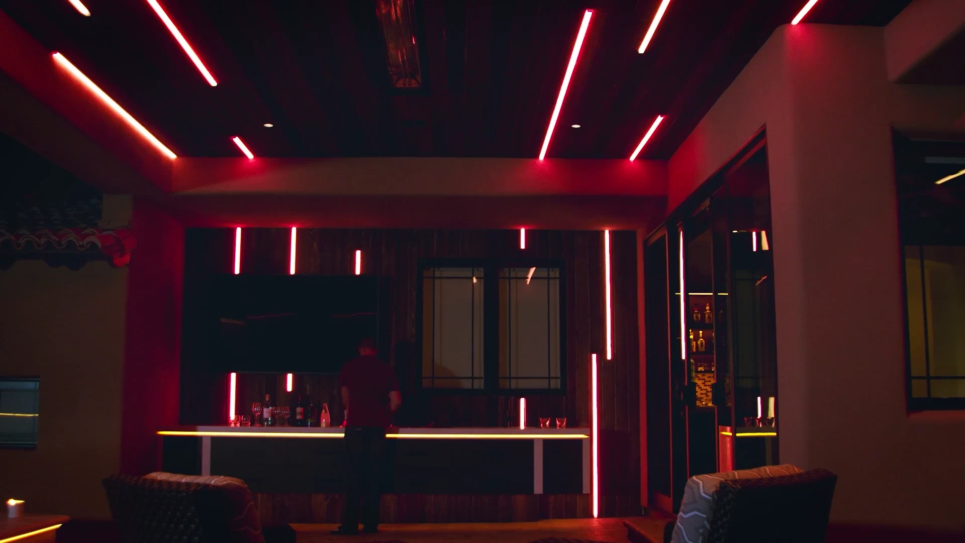 Red architectural RGB linear lighting in a modern lounge