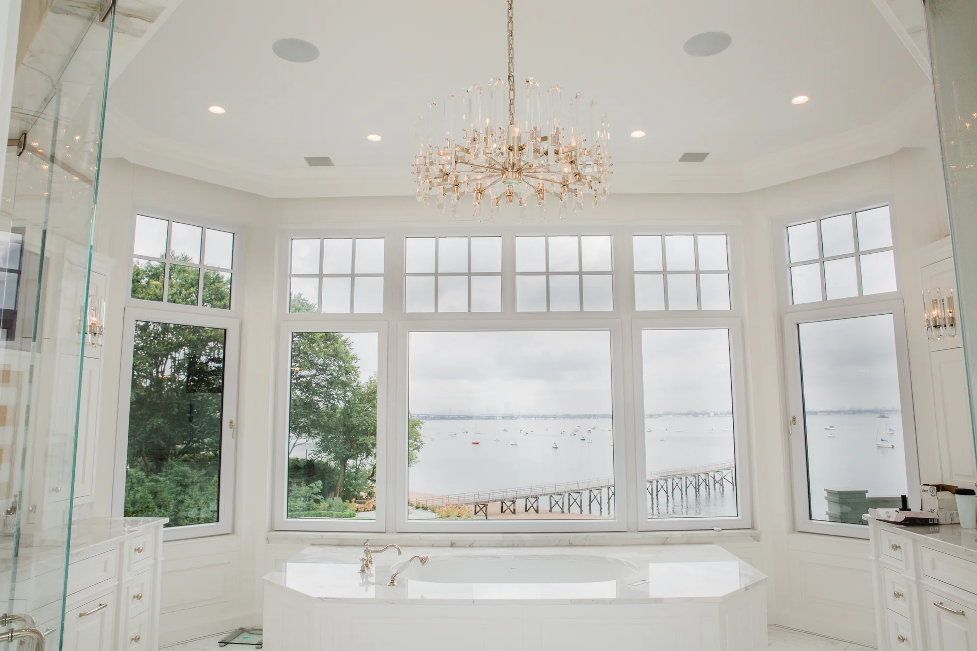 Bright finished room with four discreet ceiling speakers installed around the listening area