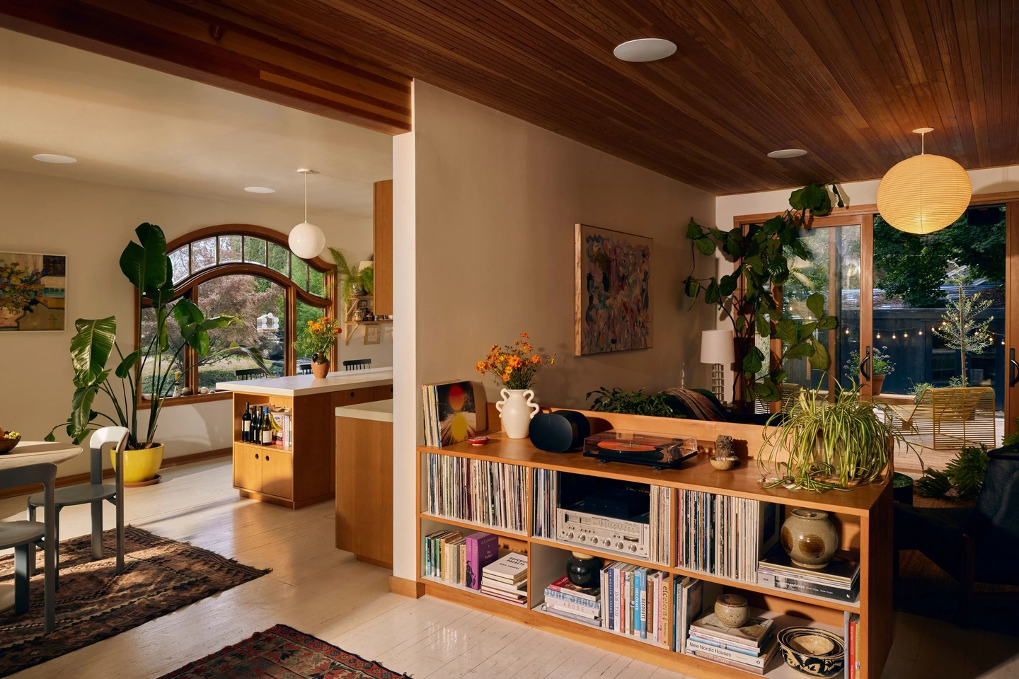 Sonos manufacturer room example with white ceiling-speaker grilles and audio equipment in cabinetry