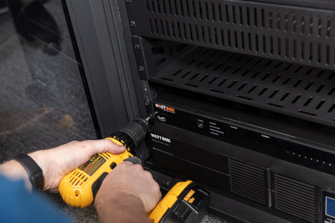 WattBox power unit being installed in a rack; ADI manufacturer example