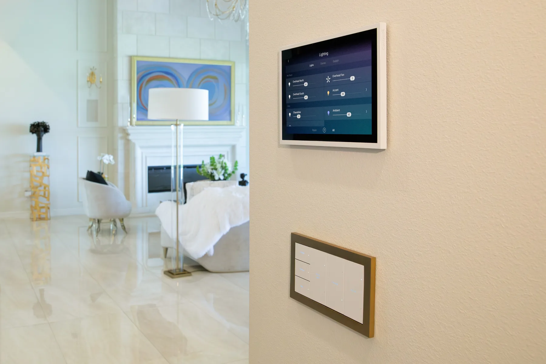 Control4 touchscreen and lighting keypad in a finished living space