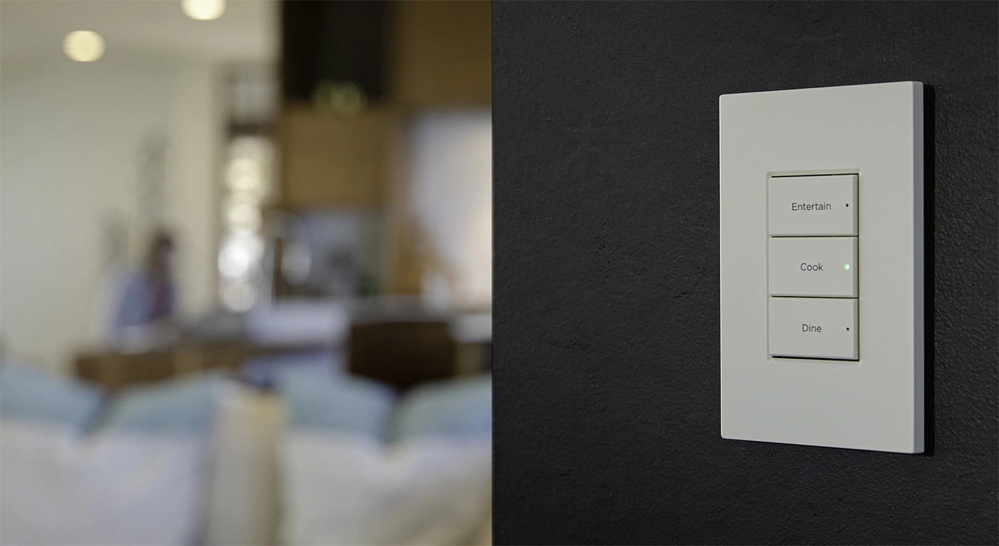 Complete three-button Control4 Contemporary keypad on a dark wall, labelled Entertain, Cook and Dine